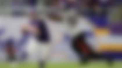 Minnesota Vikings quarterback Sam Darnold (14) runs from Houston Texans defensive end Will Anderson Jr. (51) during the second half of an NFL football game, Sunday, Sept. 22, 2024, in Minneapolis. (AP Photo/Abbie Parr)
