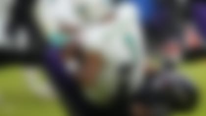 Miami Dolphins quarterback Tua Tagovailoa (1) is sacked by Baltimore Ravens linebacker Odafe Oweh (99) during the second half of an NFL football game in Baltimore, Sunday, Dec. 31, 2023. (AP Photo/Matt Rourke)