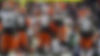 Cleveland Browns defensive end Myles Garrett (95) is congratulated by defensive end Alex Wright (94) after making a defensive stop during an NFL football game against the Baltimore Ravens, Saturday, Dec. 17, 2022, in Cleveland. (AP Photo/Kirk Irwin)