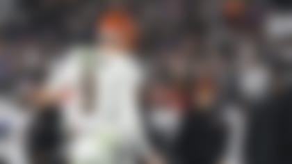 Cincinnati Bengals quarterback Joe Burrow (9) flexes his right throwing hand after an apparent injury during the first half of an NFL football game against the Baltimore Ravens, Thursday, Nov. 16, 2023, in Baltimore. (AP Photo/Terrance Williams)