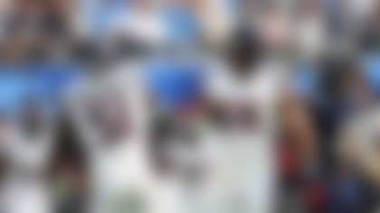 Houston Texans defensive end Danielle Hunter (55) shakes hands with defensive end Will Anderson Jr. (51) after sacking Los Angeles Chargers quarterback Justin Herbert during the first half of an NFL football game Saturday, Dec. 27, 2025, in Inglewood, Calif. (AP Photo/Kevork Djansezian)