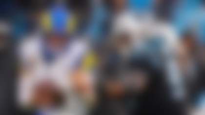 Los Angeles Rams quarterback Matthew Stafford, left, gets pressure from Carolina Panthers defensive end Derrick Brown (95) during an NFL football game, Sunday, Nov. 30, 2025, in Charlotte, (AP Photo/Rusty Jones)