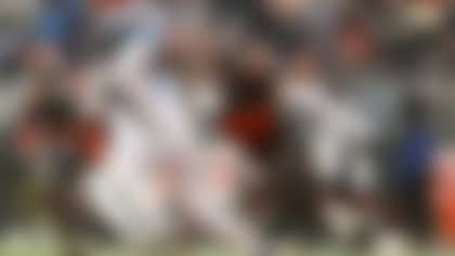 Cleveland Browns linebacker Carson Schwesinger (49) runs after Tennessee Titans running back Tyjae Spears (2) during an NFL football game, Sunday, Dec. 7 2025, in Cleveland. (AP Photo/Kirk Irwin)