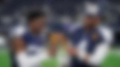 Dallas Cowboys cornerback DaRon Bland, left, and quarterback Dak Prescott celebrate by eating Thanksgiving turkey legs after the Cowboys defeated the Washington Commanders in an NFL football game Thursday, Nov. 23, 2023, in Arlington, Texas. (AP Photo/Sam Hodde)