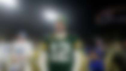 FILE - Green Bay Packers quarterback Aaron Rodgers stands on the field following an NFL football game against the Detroit Lions Sunday, Jan. 8, 2023, in Green Bay, Wis. (AP Photo/Morry Gash, File)