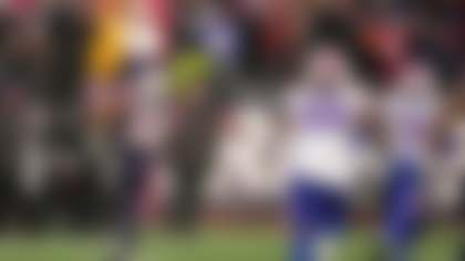 New England Patriots running back Treveyon Henderson (32) runs for a touchdown during the second half of an NFL football game against the Buffalo Bills in Foxborough, Mass., Sunday, Dec. 14, 2025. (AP Photo/Charles Krupa)