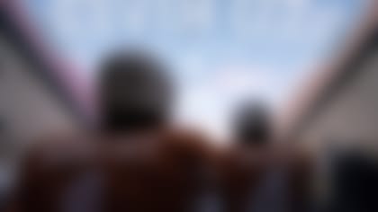 Texas wide receiver Xavier Worthy (1) and running back CJ Baxter (4) wait in the tunnel before an NCAA college football game against Oklahoma at the Cotton Bowl, Saturday, Oct. 7, 2023, in Dallas. (AP Photo/Jeffrey McWhorter)