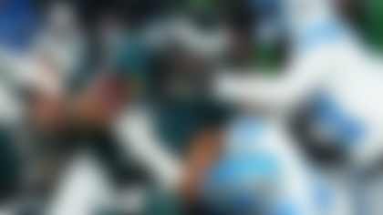 Philadelphia Eagles quarterback Jalen Hurts (1) is stopped with the ball during the second half of an NFL football game by Detroit Lions linebacker Jack Campbell (46) and Lions cornerback Amik Robertson (21) Sunday, Nov. 16, 2025, in Philadelphia. (AP Photo/Matt Slocum)