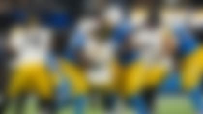 Los Angeles Chargers defensive tackle Da'Shawn Hand (91) and linebacker Tuli Tuipulotu (45) takcle Pittsburgh Steelers quarterback Aaron Rodgers (8) during an NFL football game, Sunday, Nov. 9, 2025, in Inglewood, Calif. (AP Photo/Kyusung Gong)