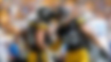 Pittsburgh Steelers linebackers Alex Highsmith, left, and T.J. Watt celebrate during the first half of an NFL football game against the Los Angeles Chargers, Sunday, Sept. 22, 2024, in Pittsburgh. (AP Photo/\Name\)