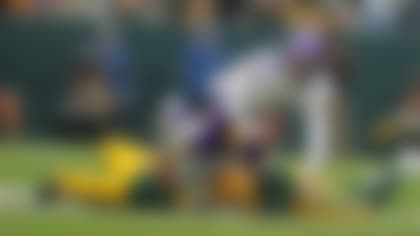 Green Bay Packers linebacker Isaiah McDuffie (58) sacks Minnesota Vikings quarterback J.J. McCarthy (9) during an NFL football game, Sunday, Nov. 23, 2025, in Chicago. (AP Photo/Melissa Tamez)