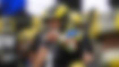 Los Angeles Rams quarterback Matthew Stafford gestures prior to an NFL football game against the Seattle Seahawks, Sunday, Nov. 16, 2025, in Inglewood, Calif. (AP Photo/Gregory Bull)