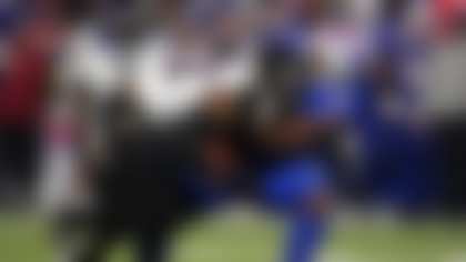 Baltimore Ravens running back Derrick Henry (22) is stopped by Buffalo Bills defensive tackle Ed Oliver (91) during the second half of an NFL football game in Orchard Park, N.Y., Sunday, Sept. 7, 2025. (AP Photo/Gene J. Puskar)
