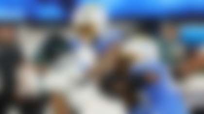 Philadelphia Eagles quarterback Jalen Hurts (1) is tackled by Los Angeles Chargers linebacker Tuli Tuipulotu (45) and outside linebacker Khalil Mack (52) during the second half of an NFL football game Monday, Dec. 8, 2025, in Inglewood, Calif. (AP Photo/Kevork Djansezian)