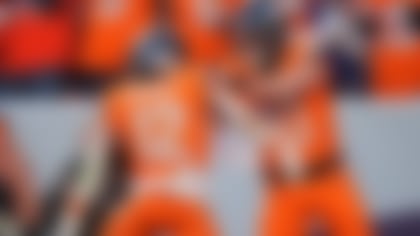 Denver Broncos quarterback Bo Nix (10) congratulates running back RJ Harvey (12) after his touchdown run in the second half of an NFL football game Sunday, Dec. 21, 2025, in Denver. (AP Photo/David Zalubowski)