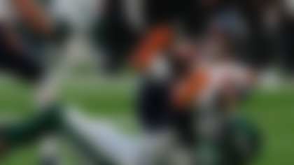 Denver Broncos quarterback Bo Nix, top, is sacked by New York Jets linebacker Jermaine Johnson (11) in the second half of an NFL football game in London, Sunday, Oct. 12, 2025. (Dave Shopland/AP Content Services for the NFL)