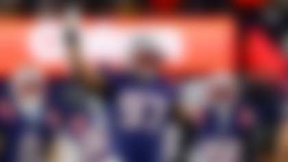 New England Patriots defensive end Milton Williams (97) reacts during the first half of an NFL wild card playoff football game against the Los Angeles Chargers, Sunday, Jan. 11, 2026, in Foxborough, Mass. (AP Photo/Greg M. Cooper)