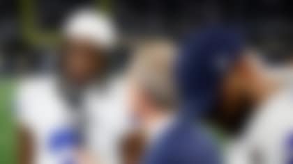 FOX Sports NFL sideline reporter Tom Rinaldi (center) interviews Dallas Cowboys receiver George Pickens (3) on the field as quarterback Dak Prescott (4) waits after an NFL football game against the Philadelphia Eagles, Sunday, Nov. 23, 2025, in Arlington, Texas. The Cowboys defeated the Eagles, 24-21. (James D. Smith via AP)