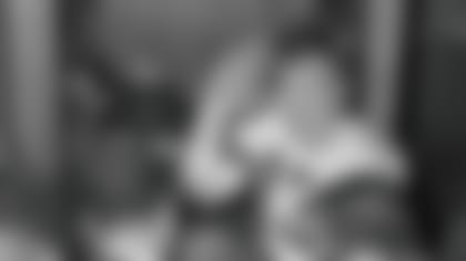 Cleveland Browns quarterback Frank Ryan gestures in the dressing room as he talks with reporters after the Browns defeated the Indianapolis Colts, 27-0, in the NFL championship football game in Cleveland on Dec. 27, 1964. Ryan died Monday. He was 87.