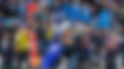 Los Angeles Rams wide receiver Davante Adams, left, has a pass defended by Carolina Panthers linebacker Christian Rozeboom, rear and cornerback Mike Jackson, left, during an NFL football game, Saturday, Jan. 10, 2026, in Charlotte, N.C. (AP Photo/Rusty Jones)