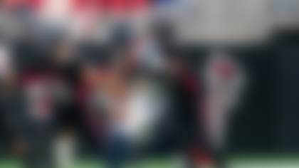 Seattle Seahawks quarterback Sam Darnold (14) runs the ball against Atlanta Falcons linebacker Kaden Elliss (55) and linebacker James Pearce Jr. (27) during the first half of an NFL football game, Sunday, Dec. 7, 2025, in Atlanta. (AP Photo/Danny Karnik)