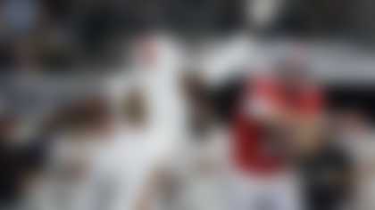 Ohio State quarterback Julian Sayin (10) tosses a pass as Miami defensive lineman Rueben Bain Jr. (4) applies pressure before the pass is intercepted by defensive back Keionte Scott, not visible, and returned for a touchdown during the first half of the Cotton Bowl College Football Playoff quarterfinal game Wednesday, Dec. 31, 2025, in Arlington, Texas. (AP Photo/Gareth Patterson)