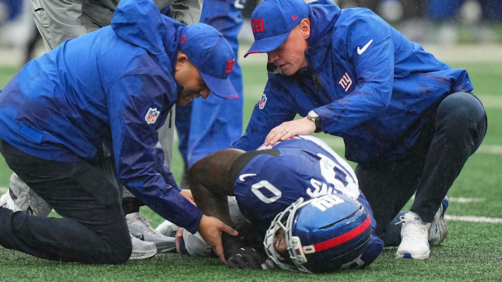 Brian Burns in a Giants uniform after suffering a torn ACL.