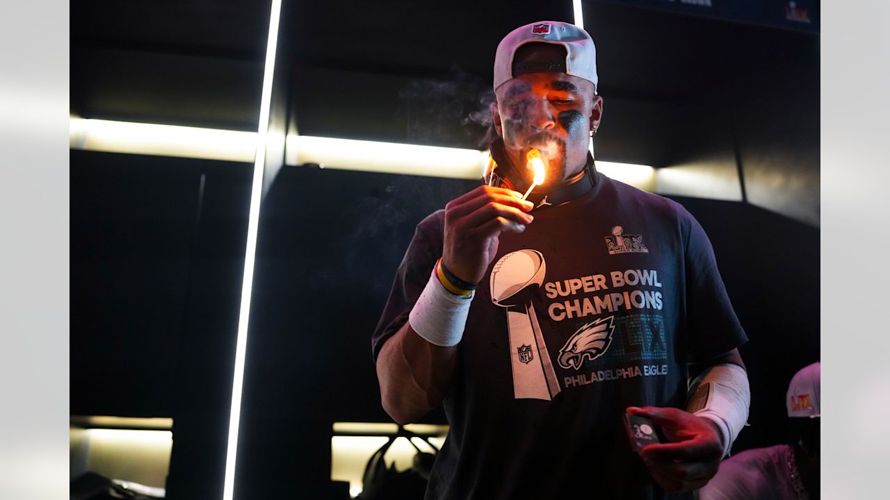 Philadelphia Eagles quarterback Jalen Hurts (1) celebrates with a cigar in the locker room after the NFL Super Bowl LIX football game against the Kansas City Chiefs on Sunday, February 9, 2025 in New Orleans, Louisiana.