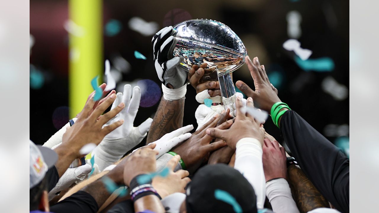 Philadelphia Eagles players hold up the Lombardi Trophy after winning the NFL Super Bowl LIX football game against the Kansas City Chiefs on Sunday, February 9, 2025 in New Orleans, Louisiana.