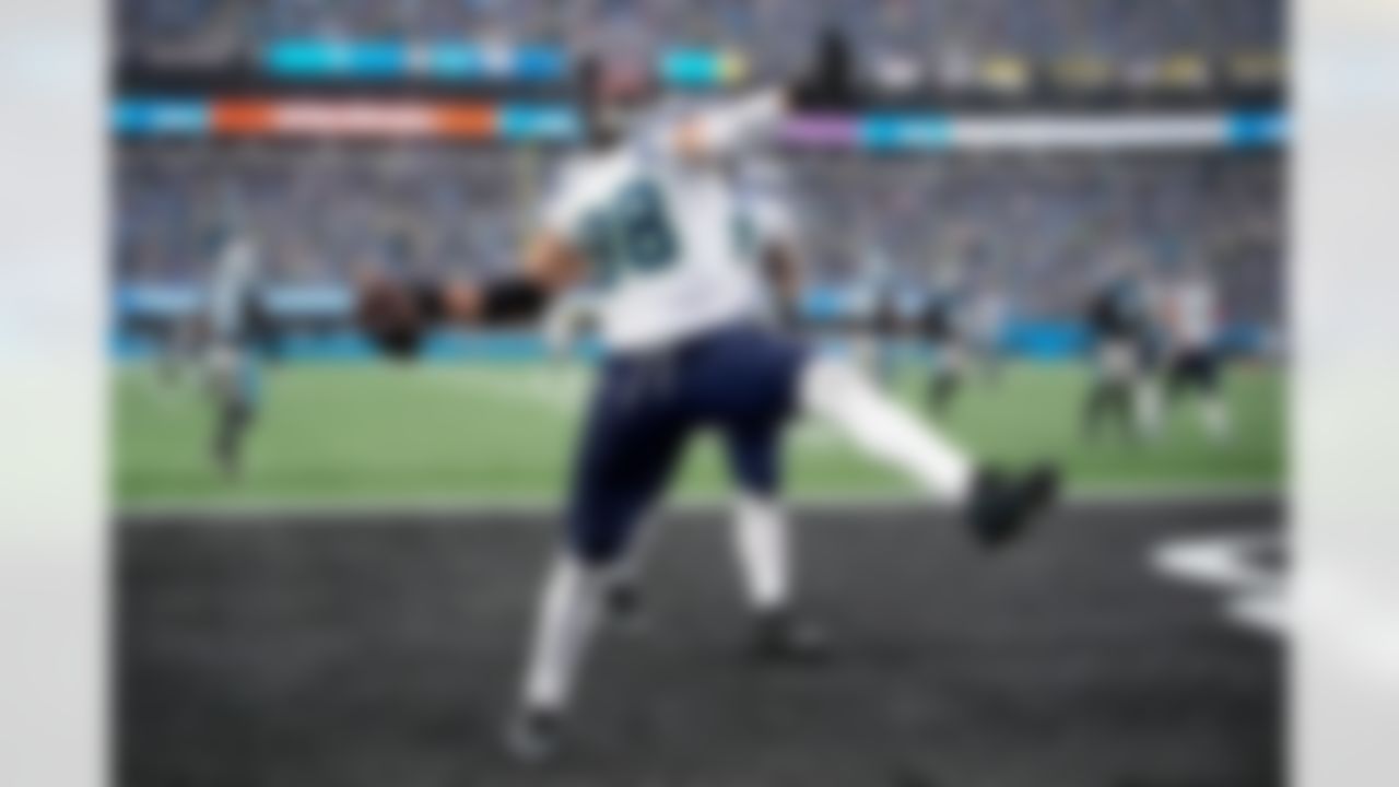 Seattle Seahawks tight end AJ Barner celebrates after scoring against the Carolina Panthers during the second half of an NFL football game, Sunday, Dec. 28, 2025, in Charlotte, N.C.