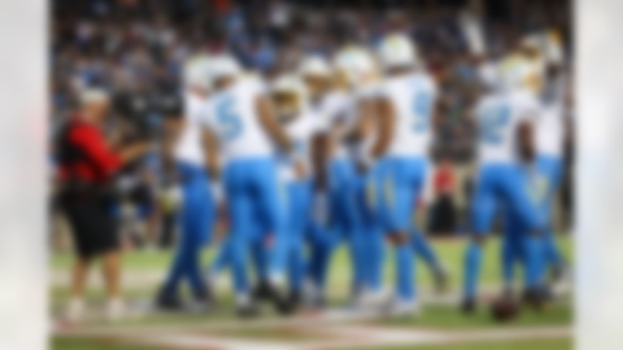 Los Angeles Chargers running back Kimani Vidal (30) celebrates a touchdown with quarterback Trey Lance (5) during an NFL football game against the Detroit Lions on Thursday, July 31, 2025 in Canton, Ohio.