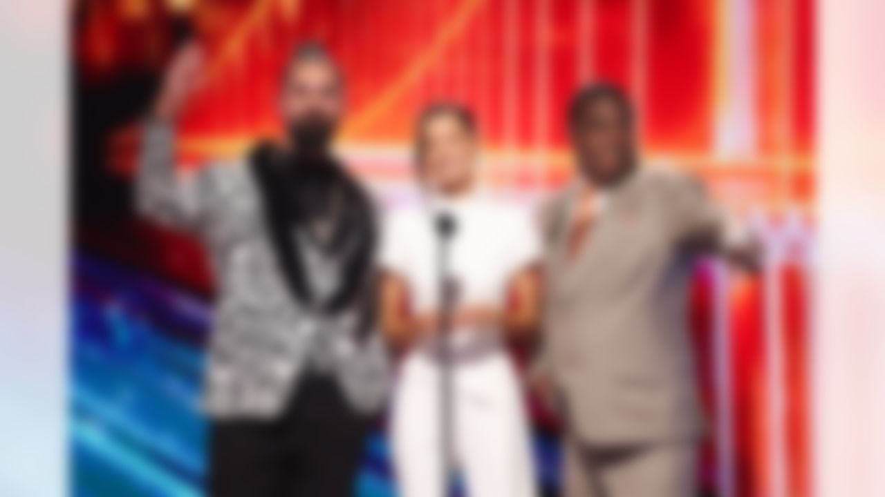 Maura Higgins, Tracy Morgan and Seth Rollins present the AP next gen moment of the year award during the NFL Honors awards show on Thursday, February 5, 2026 in San Francisco, California.