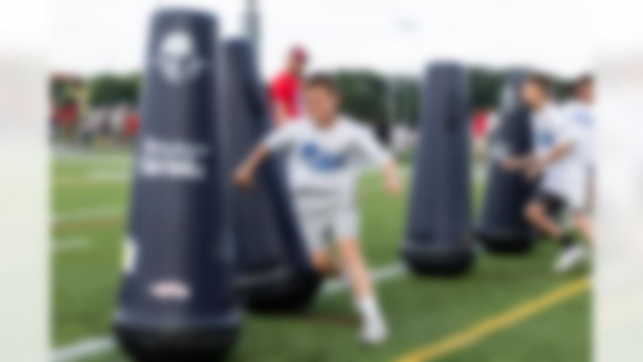 Kids run drills during the Play Football Skills Camp on Tuesday, July 29, 2025 in Canton.