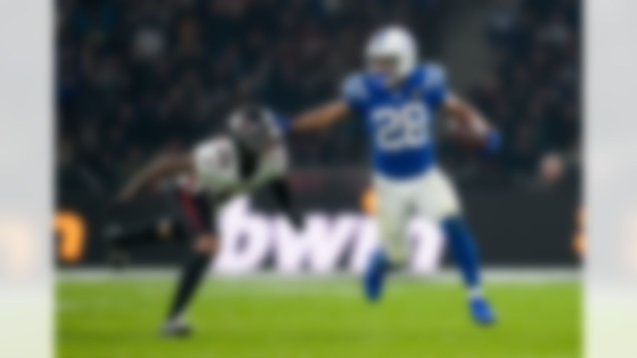 Indianapolis Colts running back Jonathan Taylor (28) stiff-arms Atlanta Falcons cornerback A.J. Terrell Jr. (24) during an NFL football game on Sunday, Nov. 9, 2025 in Berlin, Germany.