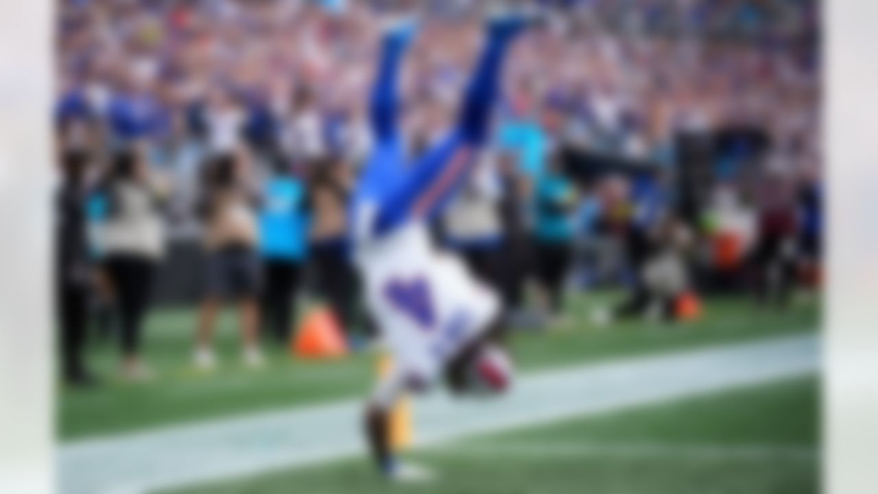 Buffalo Bills running back James Cook III (4) celebrates after scoring a touchdown against the Carolina Panthers during the first half an NFL football game, Sunday, Oct. 26, 2025, in Charlotte, N.C.