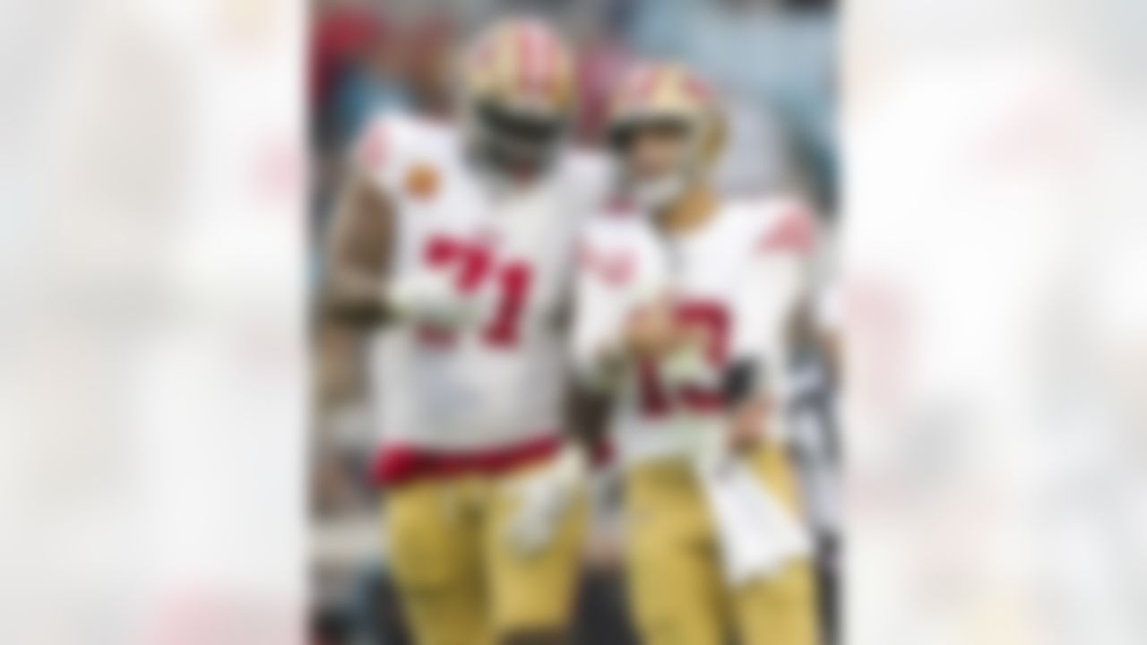 San Francisco 49ers quarterback Brock Purdy (13) and offensive tackle Trent Williams (71) celebrate during an NFL football game against the Jacksonville Jaguars on Sunday, November 12, 2023 in Jacksonville, Florida.