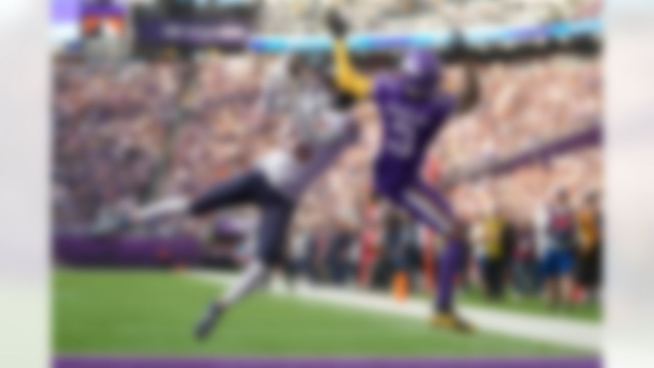 Chicago Bears cornerback Nahshon Wright (26) intercepts a pass intended for Minnesota Vikings wide receiver Jordan Addison (3) during the first half of an NFL football game on Sunday, Nov. 16, 2025, in Minneapolis.