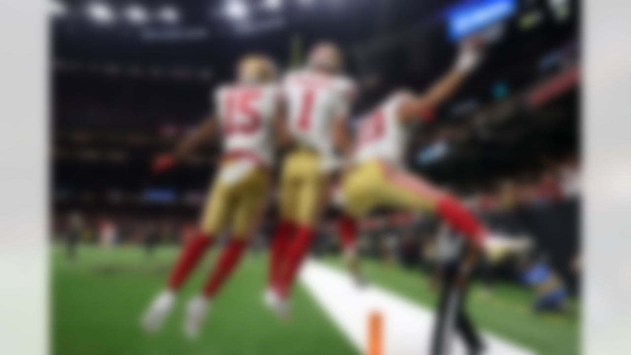 San Francisco 49ers wide receiver Jauan Jennings (15), wide receiver Ricky Pearsall (1) and running back Christian McCaffrey (23) celebrate after scoring a touchdown during an NFL football game against the New Orleans Saints on Sunday, Sept. 14, 2025 in New Orleans.