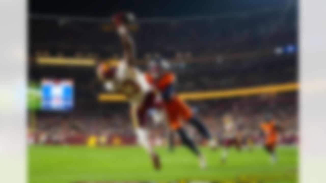 Washington Commanders wide receiver Treylon Burks (13) makes a catch for a touchdown during an NFL football game against the Denver Broncos on Sunday, November 30, 2025 in Landover, Maryland.