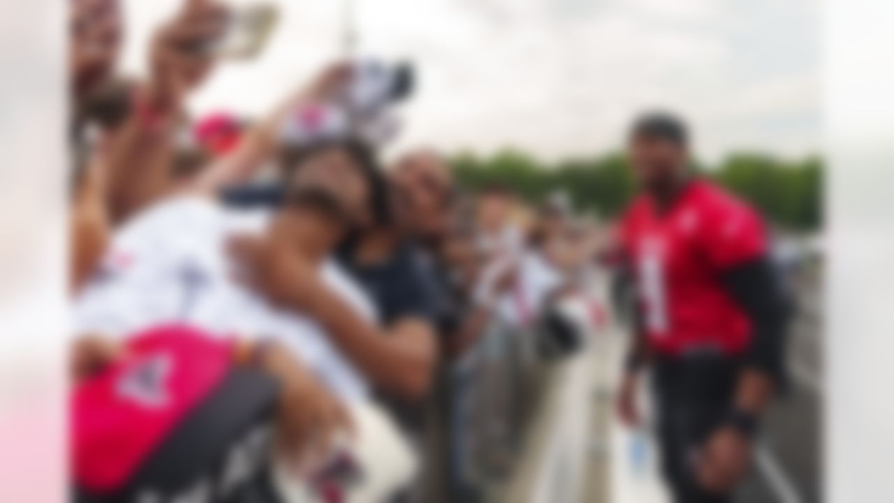 Atlanta Falcons rookie quarterback Michael Penix Jr. (9) takes a selfie with fans during an NFL training camp football practice, Saturday, July 27, 2024, in Buford, Ga.