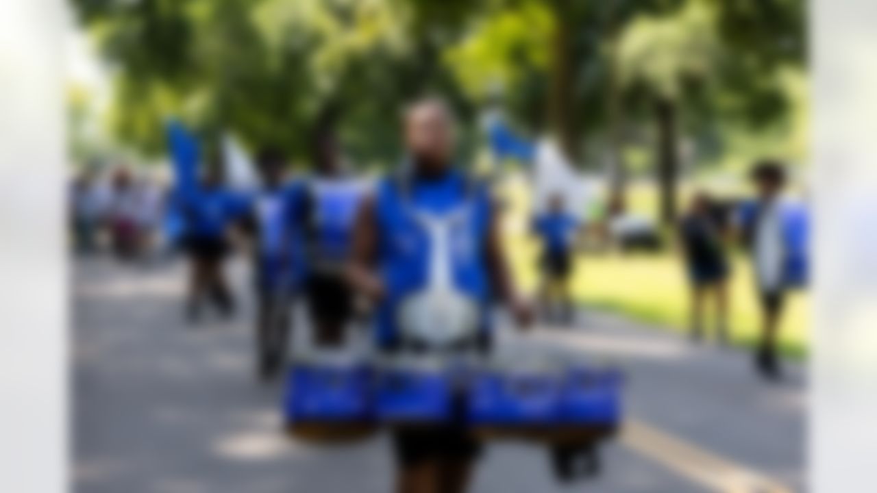 A marching band performs during the Play Football First Play on Wednesday, July 30, 2025 in Canton.