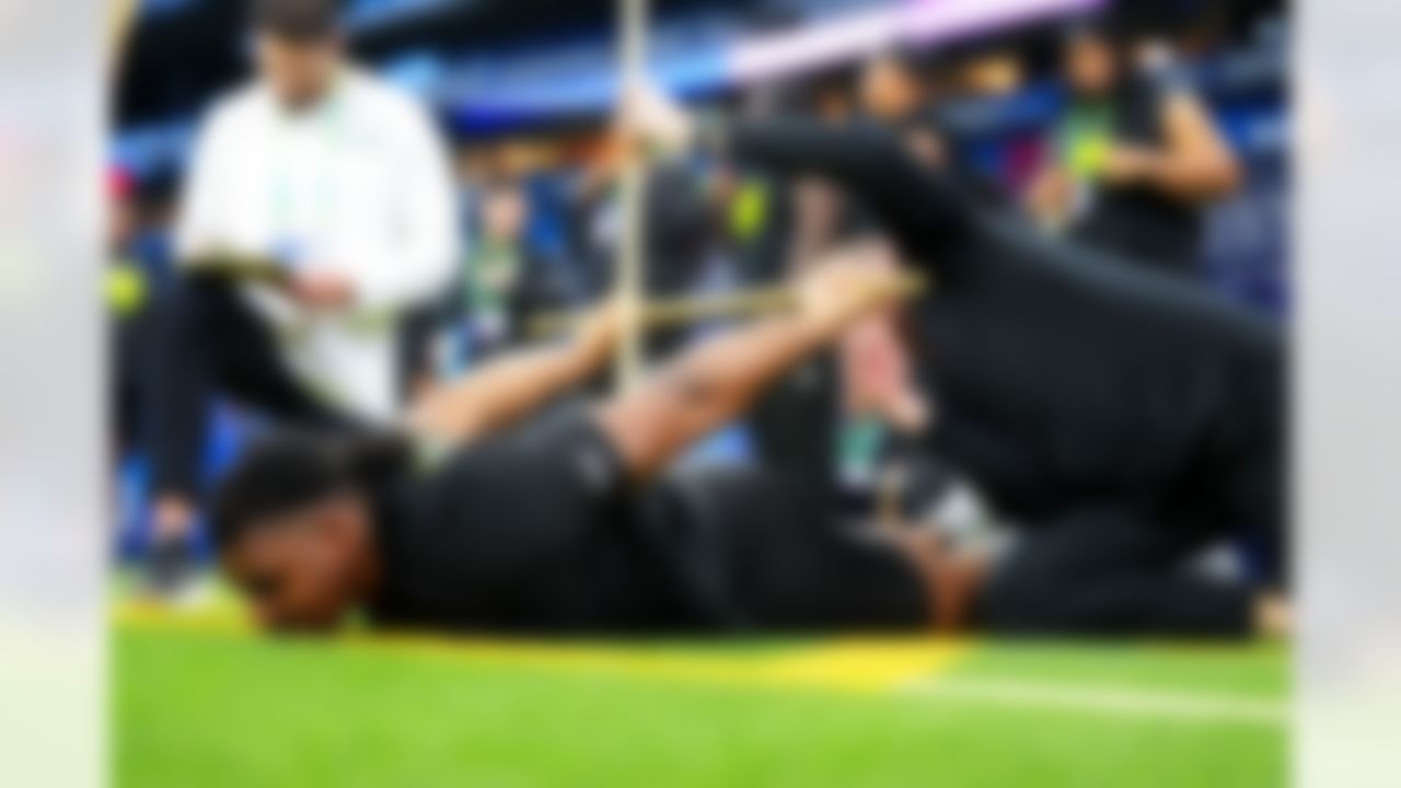 Texas A&M defensive lineman Tyler Onyedim (23) stretches during the 2026 NFL Scouting Combine on Thursday, February 26, 2026 in Indianapolis, Indiana.