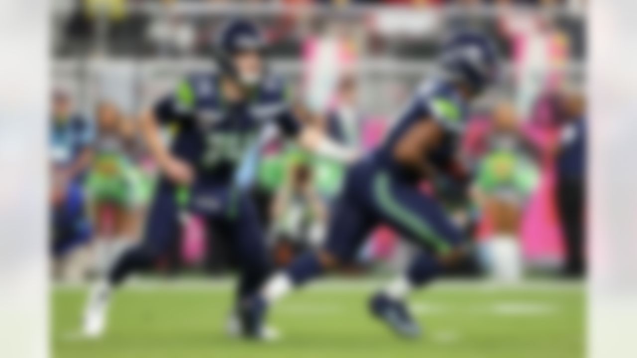 Seattle Seahawks quarterback Sam Darnold (14) hands the ball off to running back Kenneth Walker III (9) during the NFL Super Bowl LX football game against the New England Patriots on Sunday, February 8, 2026 in Santa Clara, Calif.