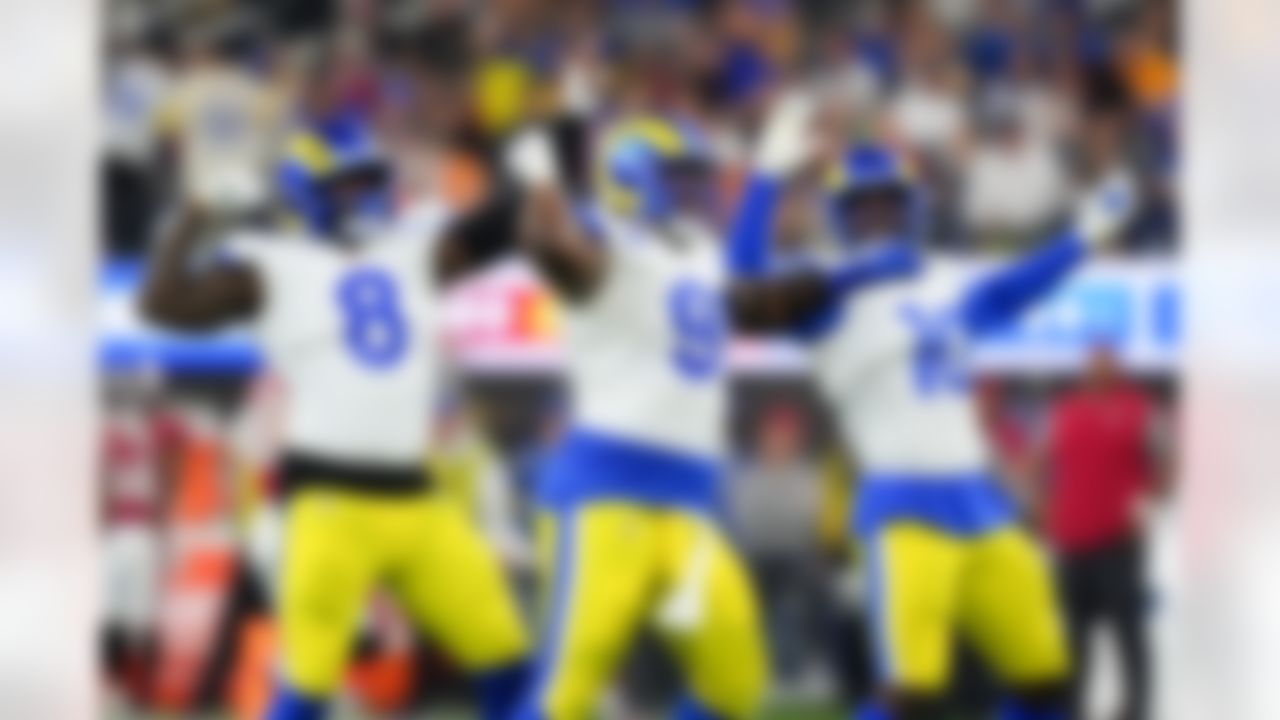 Los Angeles Rams linebacker Jared Verse (8), defensive end Kobie Turner (91) and linebacker Josaiah Stewart (10) celebrates after a play during an NFL football game against the Tampa Bay Buccaneers on Sunday, November 23, 2025 in Inglewood, California.