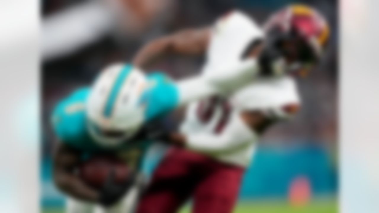 Miami Dolphins wide receiver Malik Washington (6) runs the ball after a catch during an NFL football game against the Washington Commanders on Sunday, November 16, 2025 in Madrid, Spain. The Dolphins defeated the Commanders in overtime, 16-13.