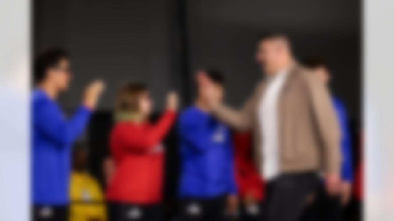 New England Patriots head coach Mike Vrabel high fives youth flag football players during Opening Night ahead of Super Bowl LX on Monday, February 2, 2026 in San Jose, California.