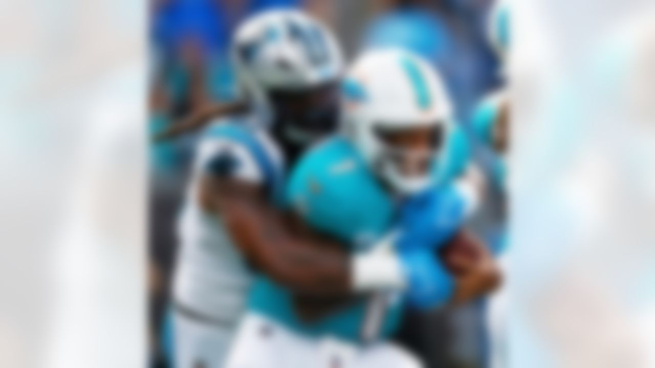 Miami Dolphins quarterback Tua Tagovailoa is sacked by Carolina Panthers linebacker Patrick Jones II during the second half of an NFL football game, Sunday, Oct. 5, 2025, in Charlotte, N.C.