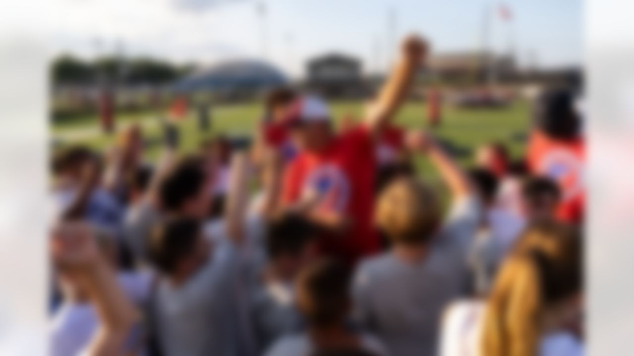 Kids huddle during the Play Football Skills Camp on Tuesday, July 29, 2025 in Canton.