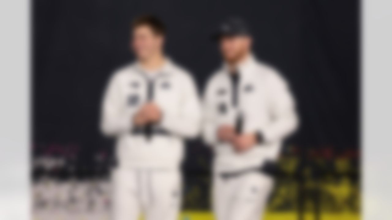 New England Patriots quarterback Drake Maye (10) and Seattle Seahawks quarterback Sam Darnold (14) smile on stage during Opening Night ahead of Super Bowl LX on Monday, February 2, 2026 in San Jose, California.