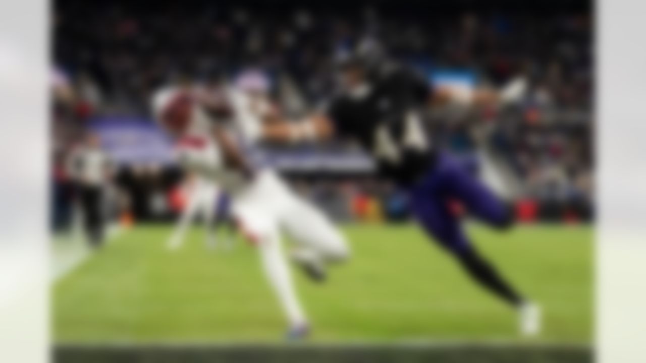 New England Patriots wide receiver Kyle Williams (18) completes a catch and scores a touchdown against Baltimore Ravens cornerback Marlon Humphrey (44) during an NFL football game, Sunday, Dec. 21, 2025, in Baltimore.